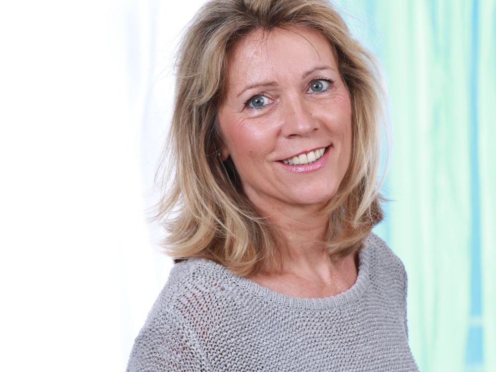 Mature woman looking at camera smiling